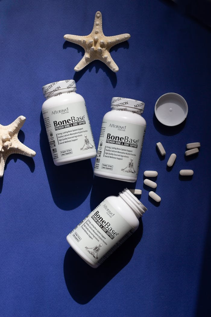 BoneBase supplements with starfish on a blue background, emphasizing bone health and joint support.