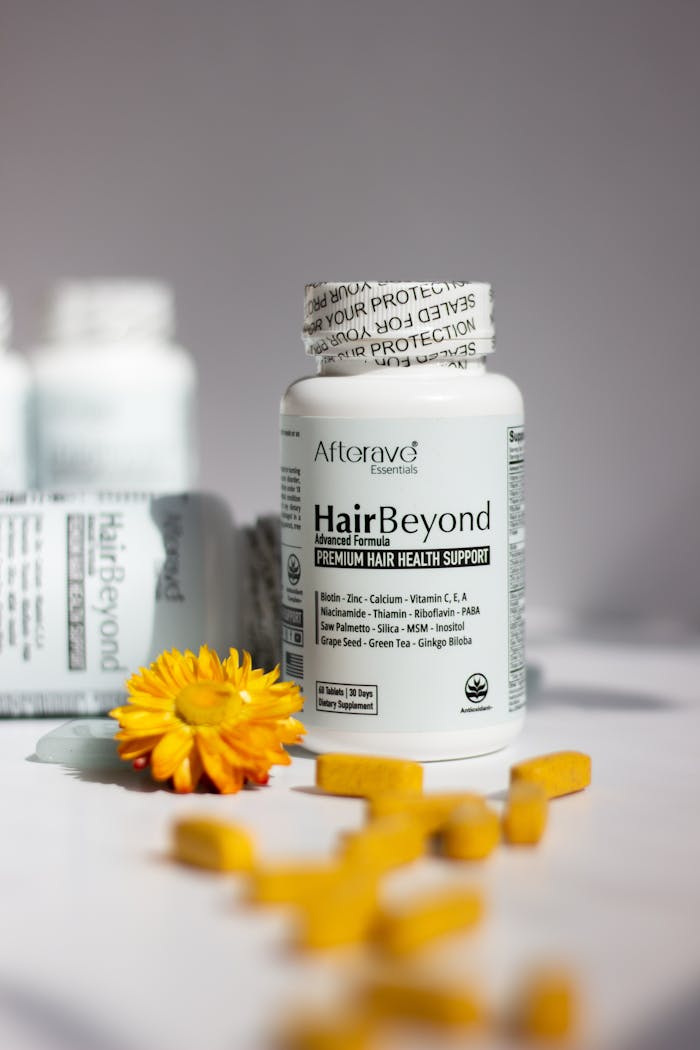 HairBeyond premium hair health supplement bottles with vitamins in focus.
